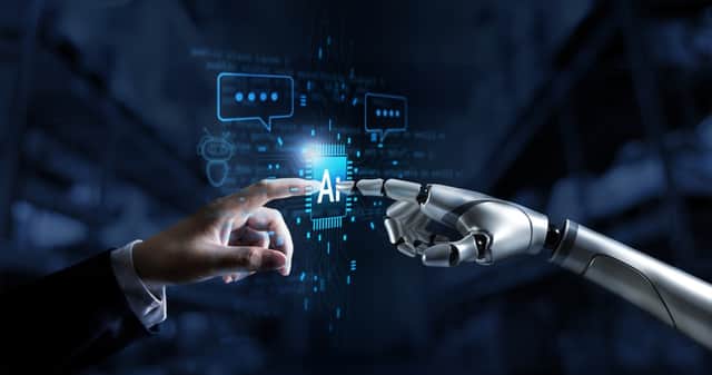Hands of robot and human connect artificial intelligence AI circuit board to virtual smart chatbot with a command for automation generate, learning technology artificial intelligence machine, AI.